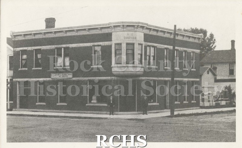 Black and white photograph of Janesville Granite and Marble Works, present location of Pember-Nuzeum Clinic.