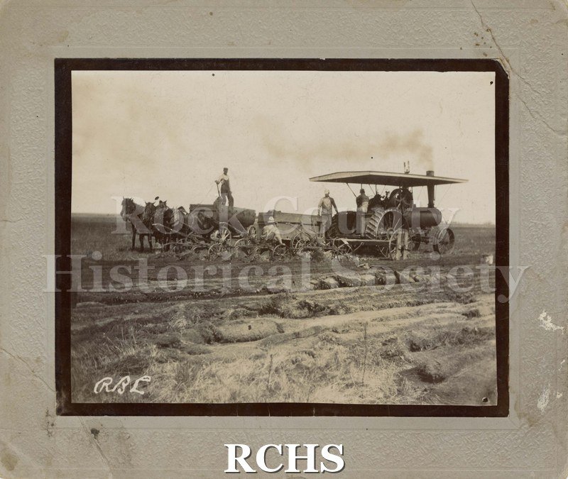 Black and white photograph of a threshing machine, probably Rock County.
