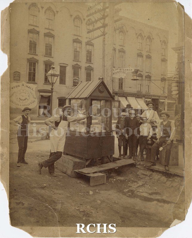 Black and white photograph of a popcorn stand in Janesville, WI.