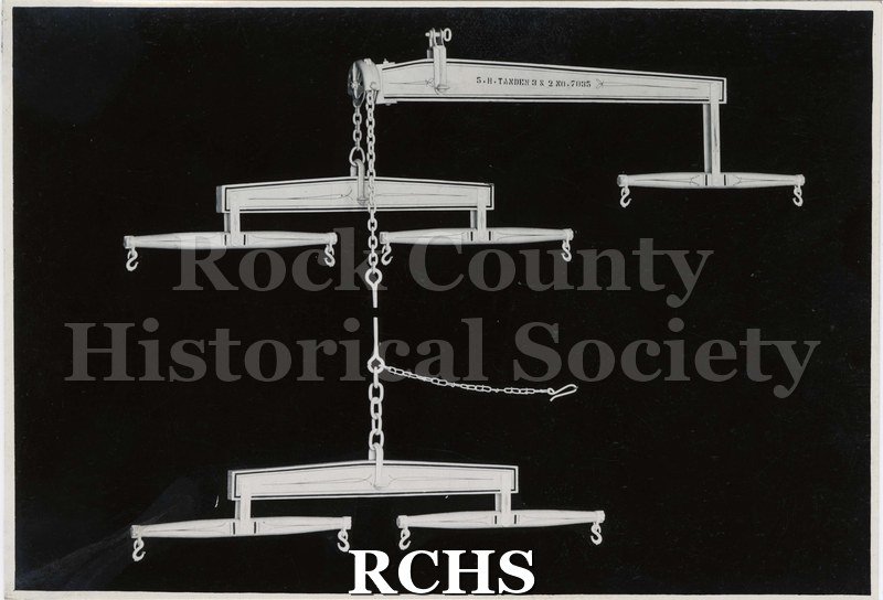 Black and white photograph of Janesville Machine five horse hitch for a plow.