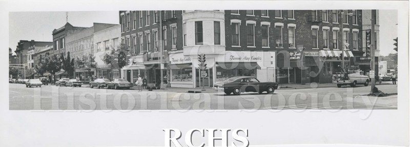 Black and white photograph of the southwest corner of Main and Milwaukee, photographed in 1974 by Tom Bowditch for Janesville, published by the League of Women.