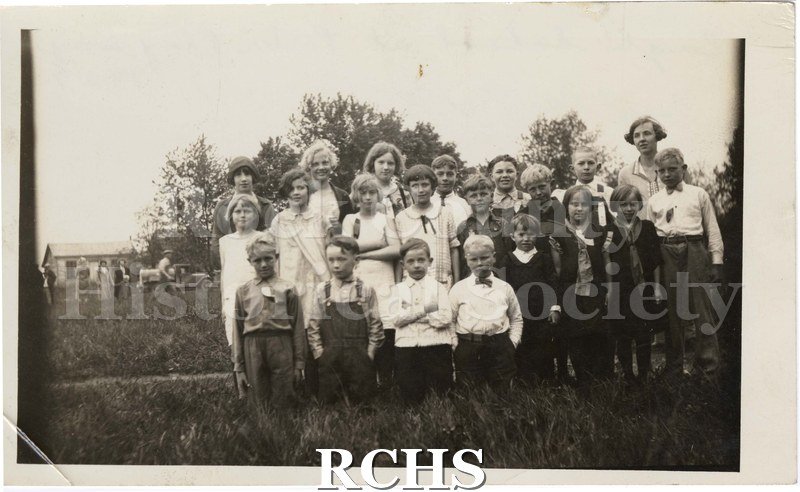 Black and white photograph of students and teacher of Eagle school pose at Porter Play Day in 1927.