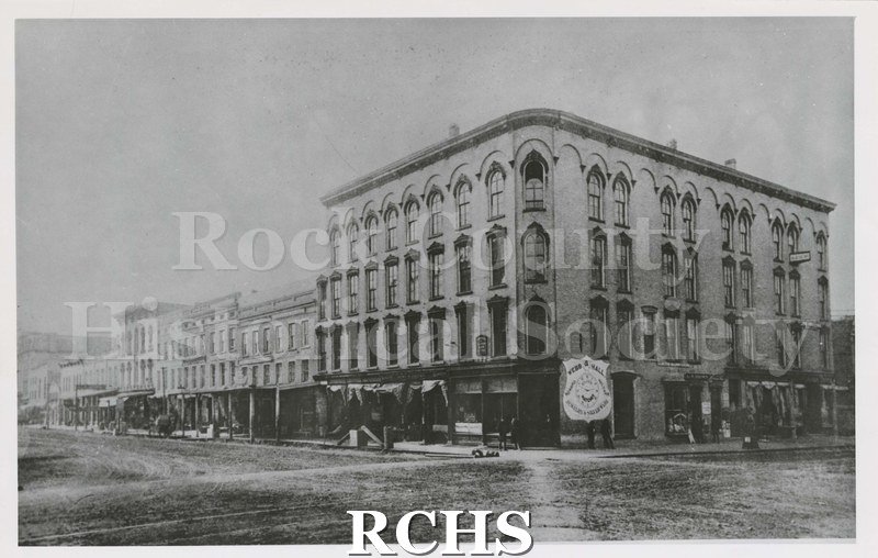 Black and white photograph of the Hayes block in 1895. Webb and Hall Jewelry and Silverware visible.