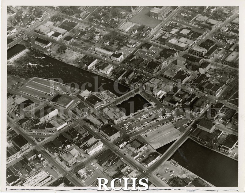 Black and white aerial photograph of Janesville, looking Northwest up the Rock River. a. 1965?