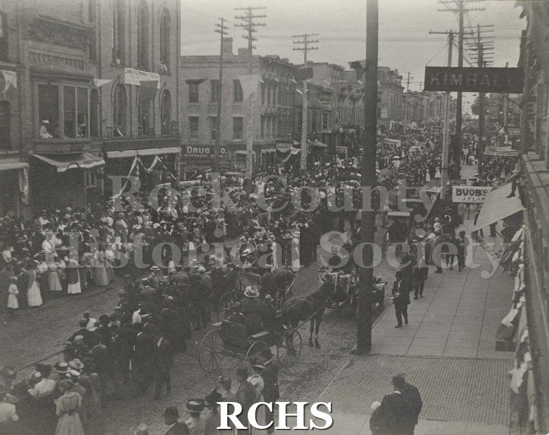 Black and white photograph of Nonesuch Brothers Circus Parade on Milwaukee Ave., Janesville.