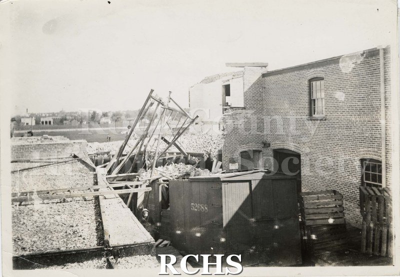 Black and white photograph of an accident at Hohenahdle canning factory. Shows car No. 52688 has crashed into building.