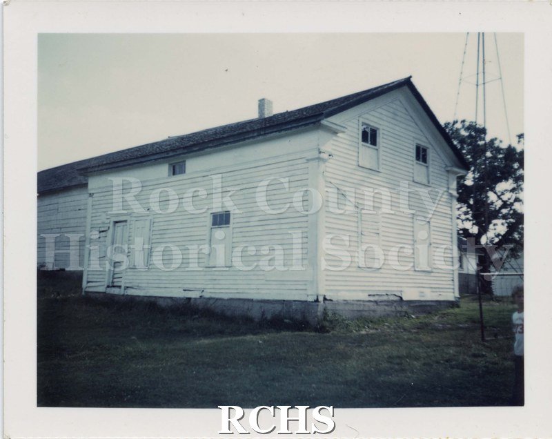Black and white photograph of an outbuilding on Paul Campion Farm, Milton, Wis. Highway 26 & Bingham Rd.