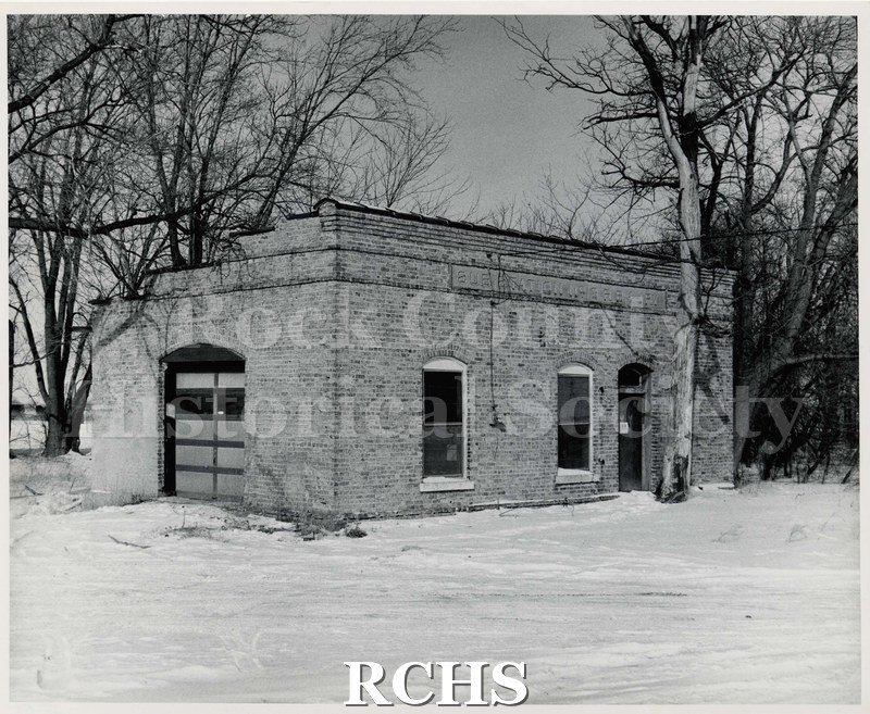 Black and white photograph of the Rockford & Interurban Substation #3. The building is in a winter setting.