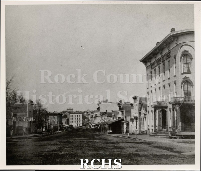 Black and white photograph looking east from the Corner of High Street with West Milwaukee Street.