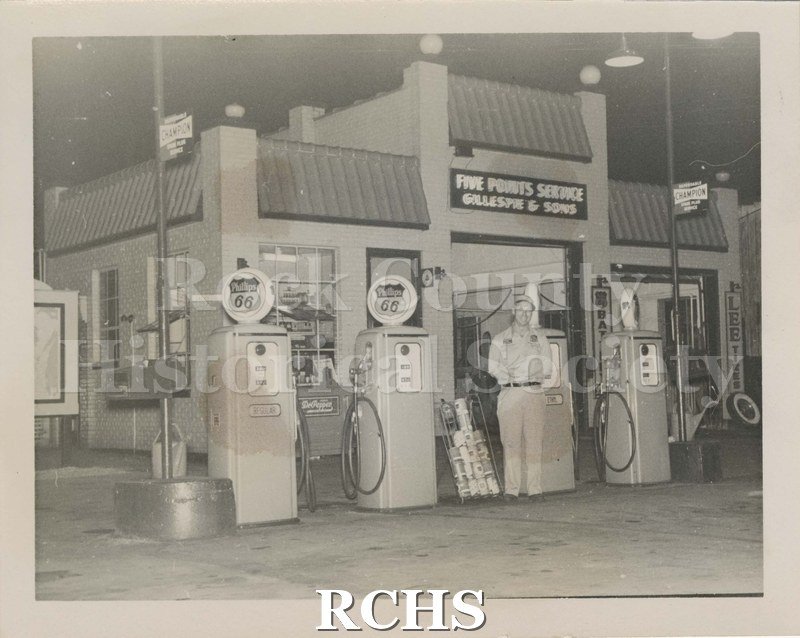 Black and white photograph of Five Points Service Station: Gillespie (Thomas A.) and Sons, at the intersection of West Milwakee and Pleasant (now West Court).