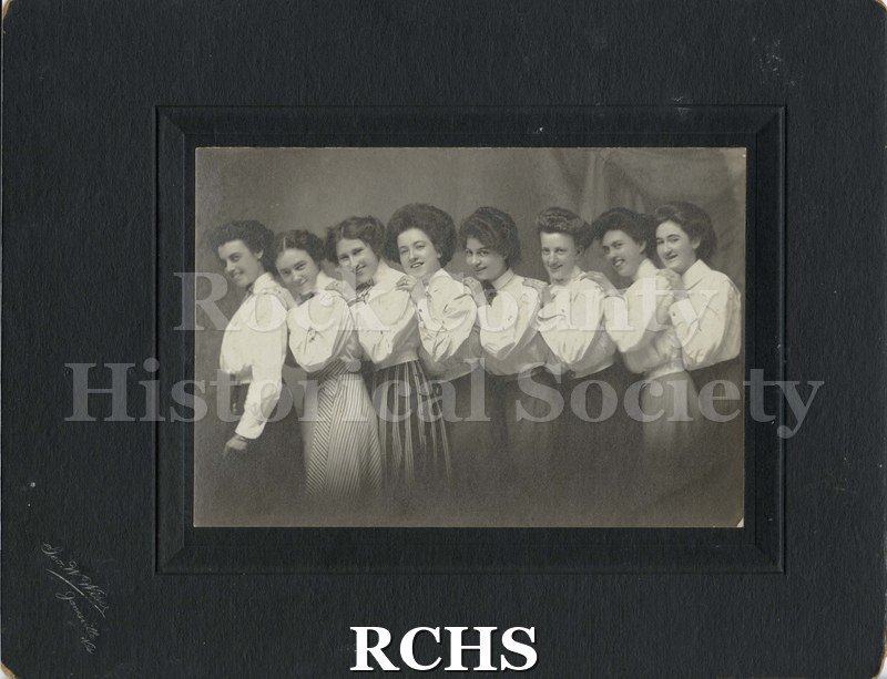 Black and white photograph of eight Rock County Telephone Company operators.