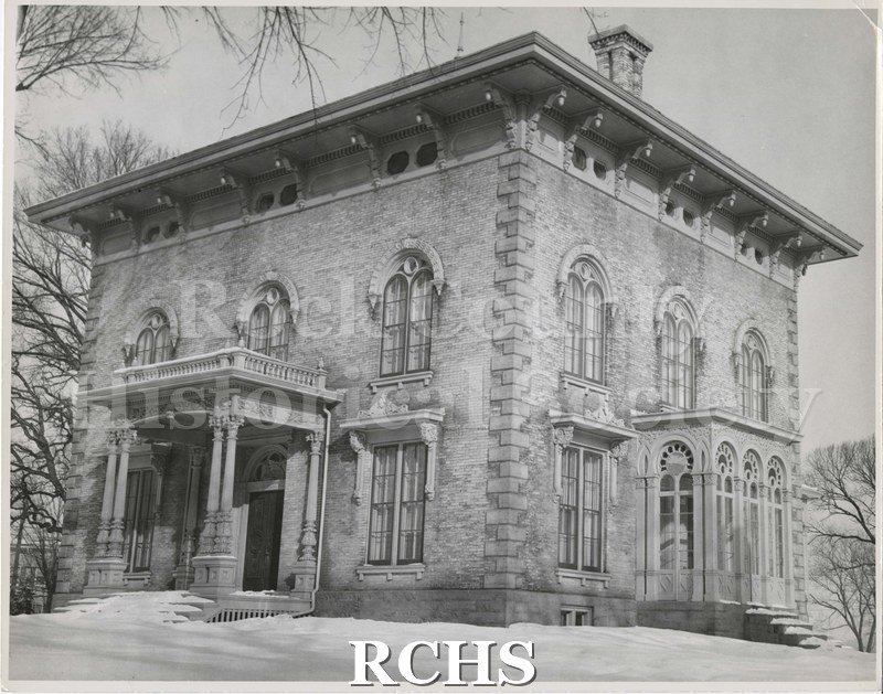 Black and white photograph of the Tallman House from east side. Shows leafless trees in background.