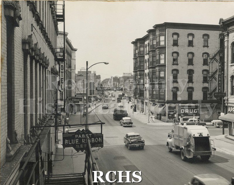 Black and white photograph of Milwaukee Street, Janesville, WI c. 1955.