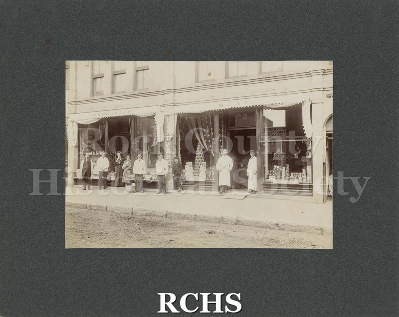 Black and white photograph of Norcross Block, corner of Dodge and S. River Street: Blount Grocery Store.