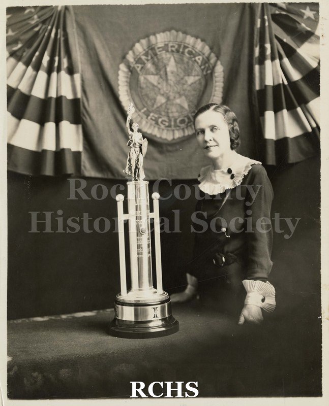 Black and white photograph of Mollie Coe and Trophy.