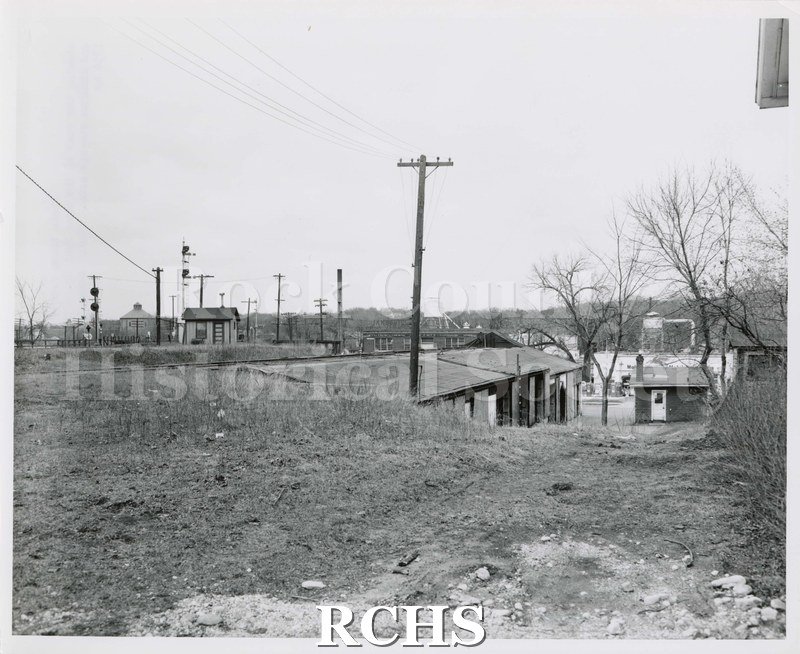 Black and white photograph of Swan Fuel Co. from the rear showing railroad tracks. "Photo taken from a point just east of N.