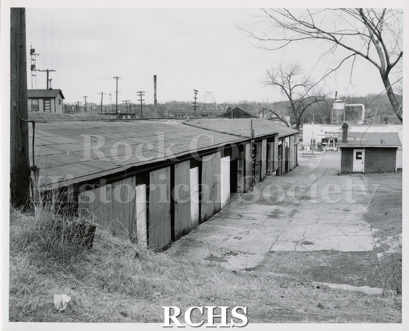 Black and white photograph of Swan Fuel Co. coal bins and storage area..