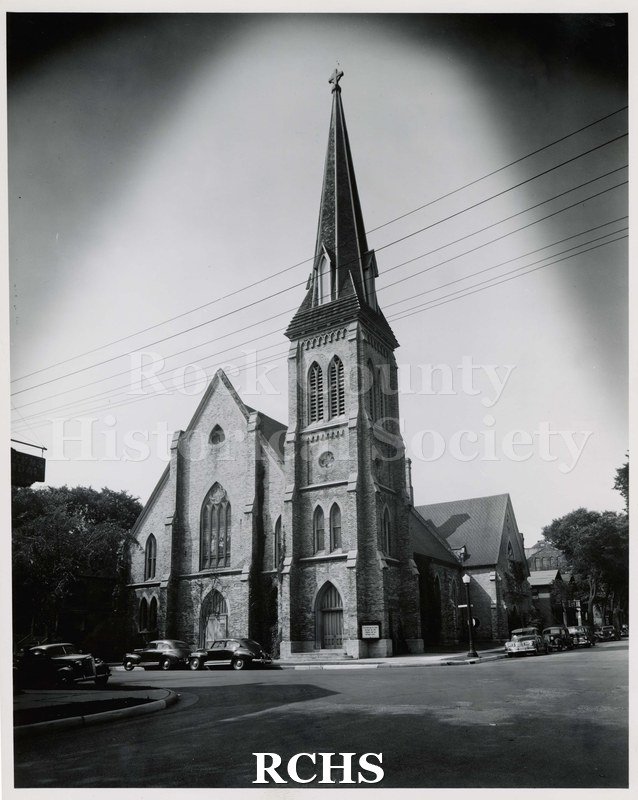 Black and white photograph of the First Congregational Church with cars parked in front.