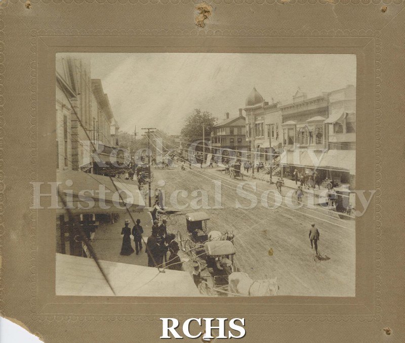 Black and white photograph of a city, possibly Evansville, WI., in early 20th century.