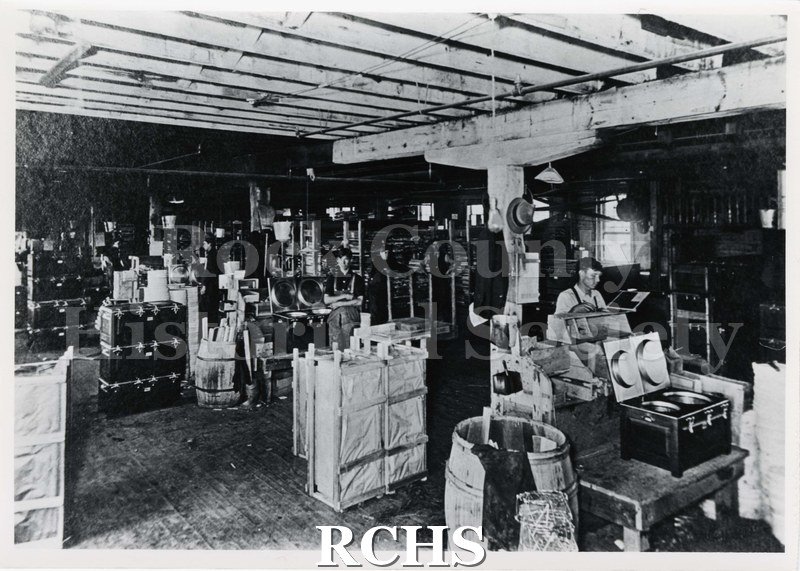 Black and white photograph of Caloric Cooker Co. Shows men working at a factory.