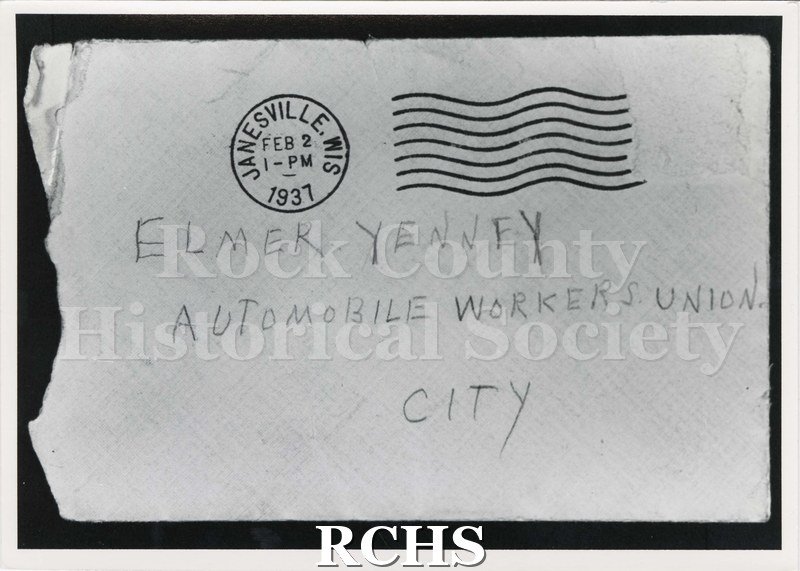 Black and white photograph of an envelope addressed to "Elmer Yenney Automobile Workers Union City", postmarked Janesville, Wis, Feb 2, 1-PM 1937.