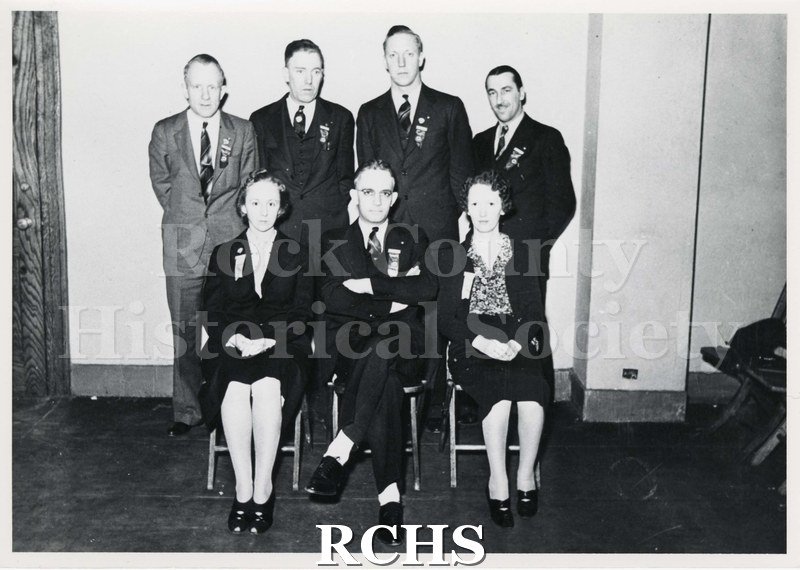 Black and white photograph of delegates of International Convention UAWA-AFL 1939, Shows two women and five men at a convention.