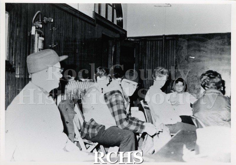 Black and white photograph of Local #663 workers strike meeting at Parker Pen, 1970. Shows several people sitting in chairs.