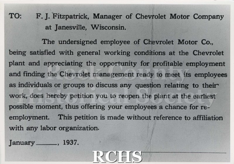Black and white photograph of a petition card asking Chevrolet Motor Company at Janesville, Wisconsin, to reopen the plant. It reads: "To: F. J.