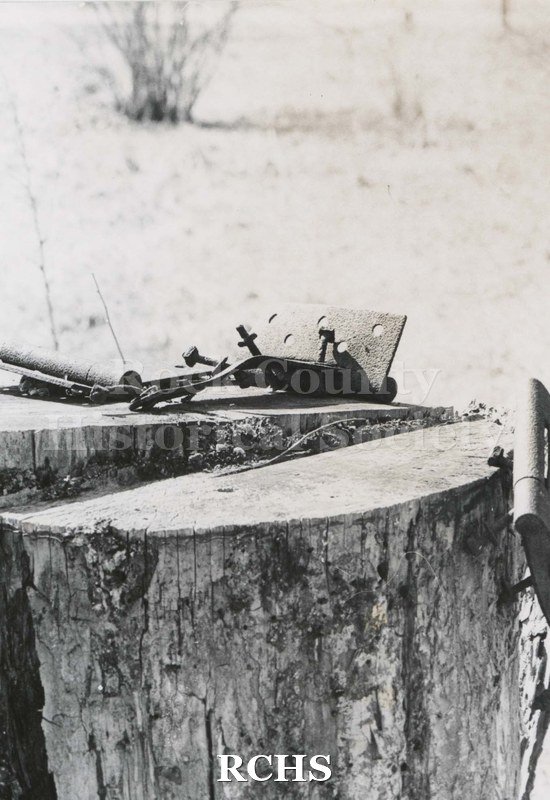 Black and white photograph of Hodson House, Shopiere Road. Shows two pieces of wood on which there is part of a hinge.