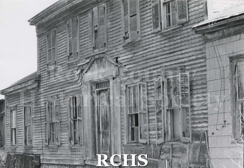Black and white photograph of Hodson House, Shopiere Road. Shows an abandoned two-story house.