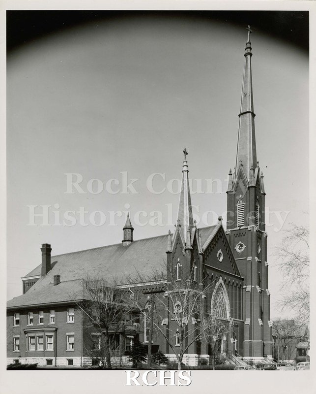 Black and white photograph of St. Mary's Catholic Church, Janesville, WI, shown with two steeples.