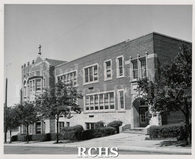 Black and white photograph of St. Mary's School, Janesville, WI, a two story brick school building.