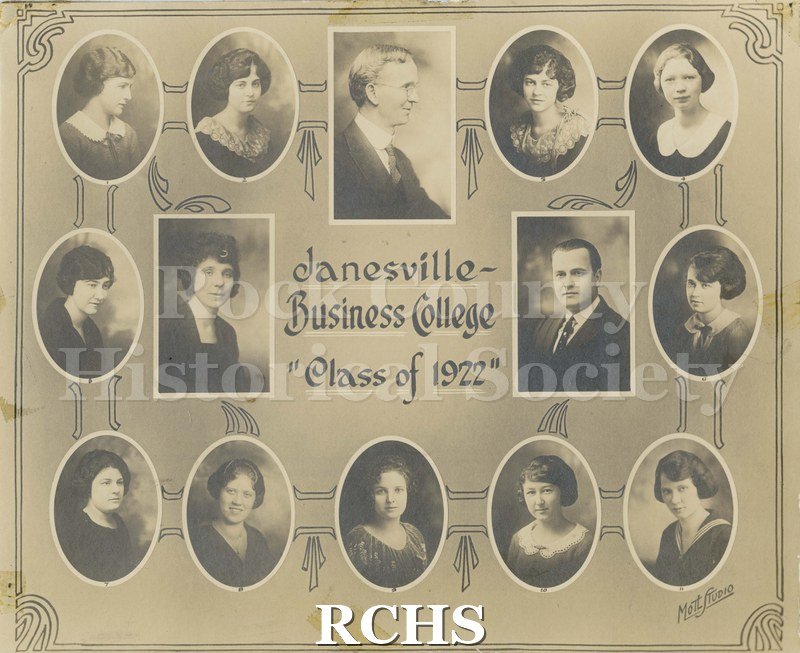 Black and white photograph of Janesville Business College, Class of 1922. Fourteen people are depicted: twelve women, two men. "Ruth Falter" is written on the back.