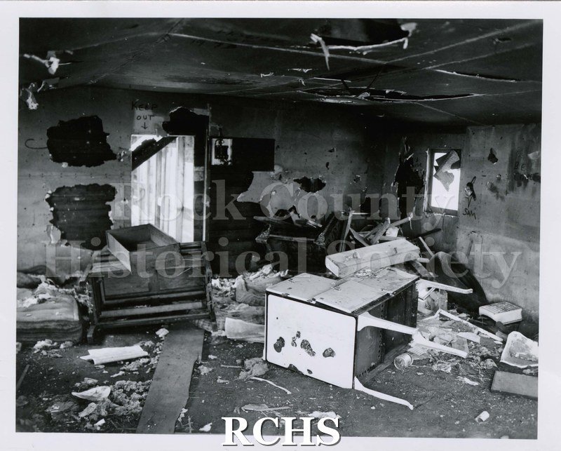 Black and white photograph of 1924 S. Grant St., Janesville, WI. Shows the inside of a building.