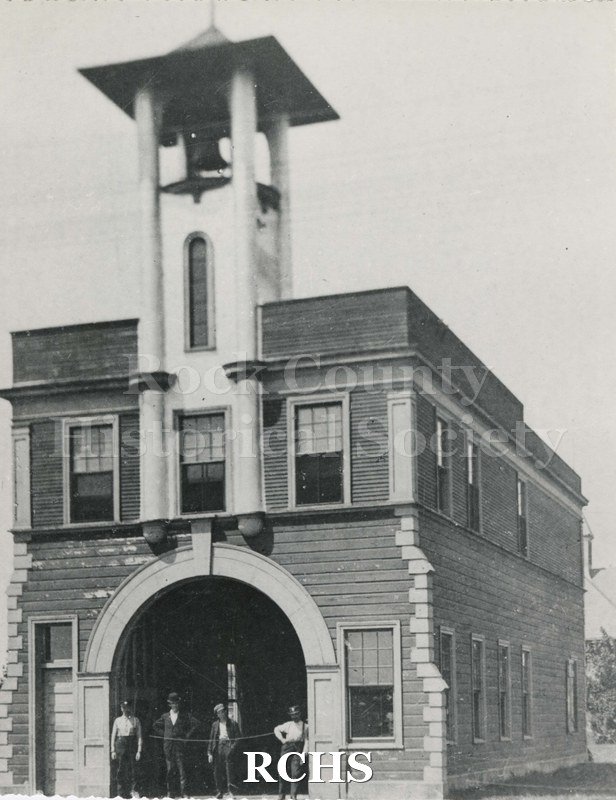 Black and white photograph of Janesville Fire Dept. House House No. 3, a two-story fire house with a bell tower on top.