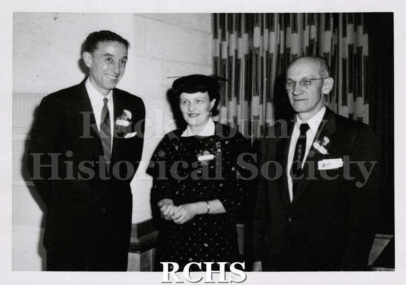 Black and white photograph of Ken Bick, Mrs. Palmer Gilbertson, and Earl Brown. .