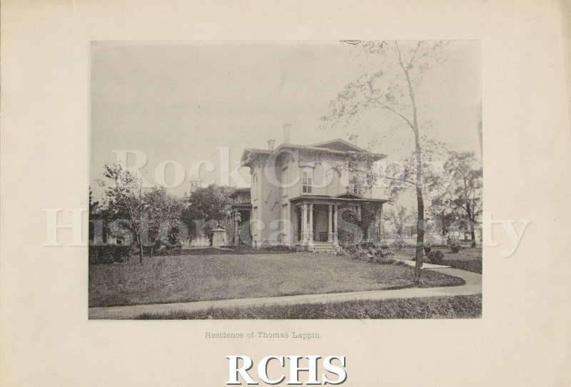 Black and white photograph of residence of Thomas Lappin. Shows a two story house with a pillared porch.