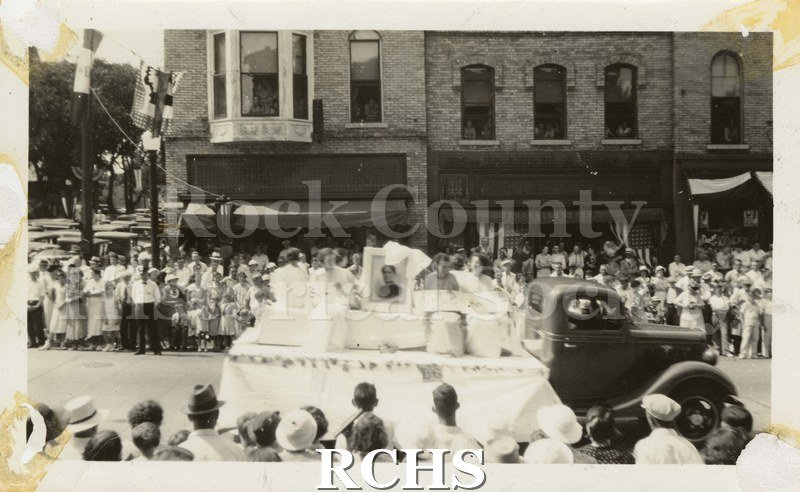 Black and white photograph of W.C.T.U. Float 1935. Shows a float on a street with a large crowd of people watching.