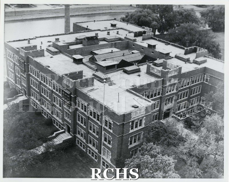 Black and white photograph of an aerial view of Janesville High School. Written on reverse: "Aerial view 1950s".
