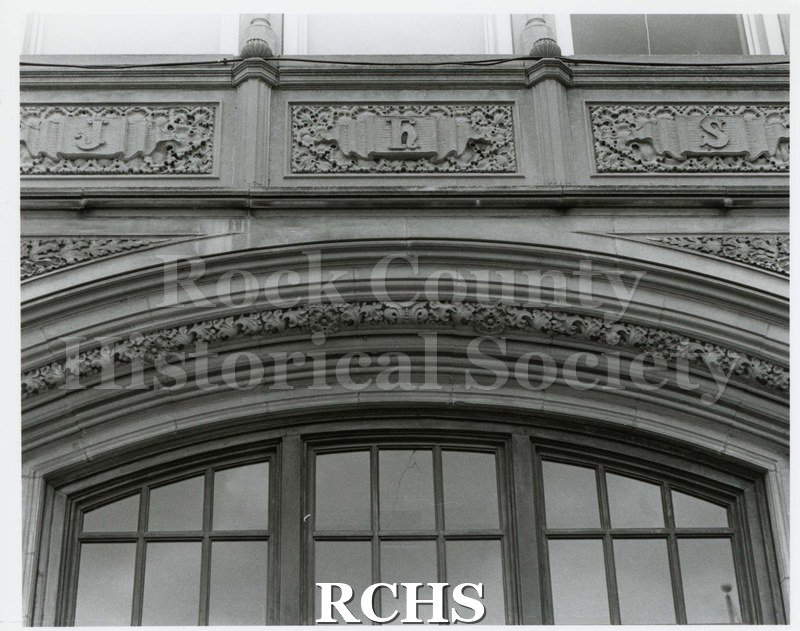 Black and white photograph of the architectural details of entrance to Janesville High School, Main Street.