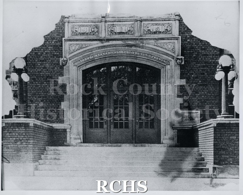 Black and white photograph of the entrance to Janesville High School. Written on reverse: "1926".