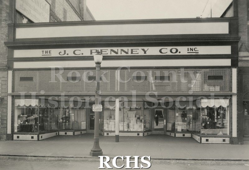 Black and white photograph of J. C. Penney Co. Inc. building on Main Street, Janesville, WI.