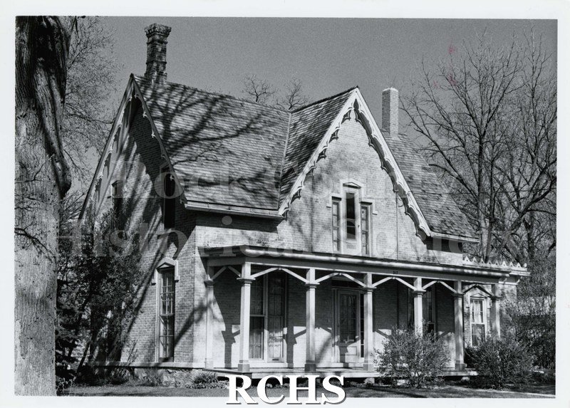 Black and white photograph of Williams-Scott house, a two story house with a pillared porch.