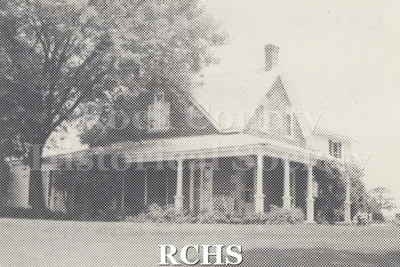 Black and white photograph of Kellogg-Damrow House, a two story house with a pillared porch.