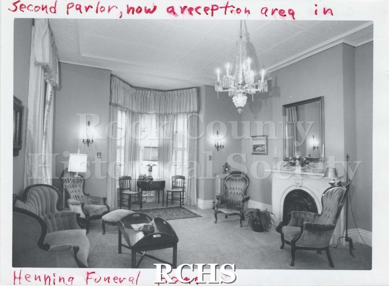 Black and white photograph of the second parlor in Henning Funeral Home.