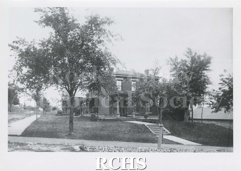 Black and white photograph of 120 St. Lawrence Avenue, a two story house with a pillared porch on the front and on the side.
