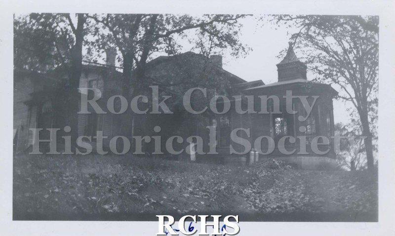 Black and white photograph of J. B. Crosby House. Shows a two story house set among trees. On bottom: "10-6-1949".