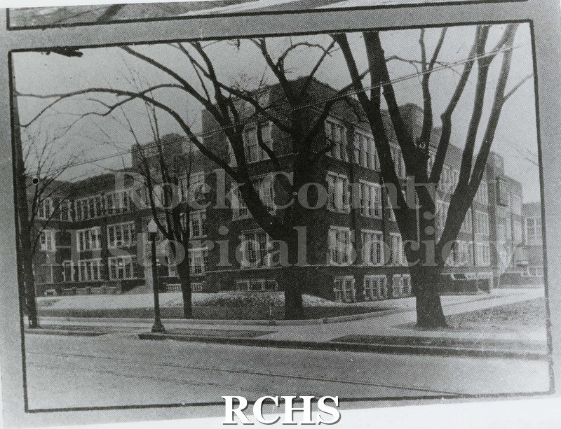 Black and white photograph of Janesville High School. Main Street view. Written on reverse: "Third High School 1923- 1924 Phoenix pg 15".