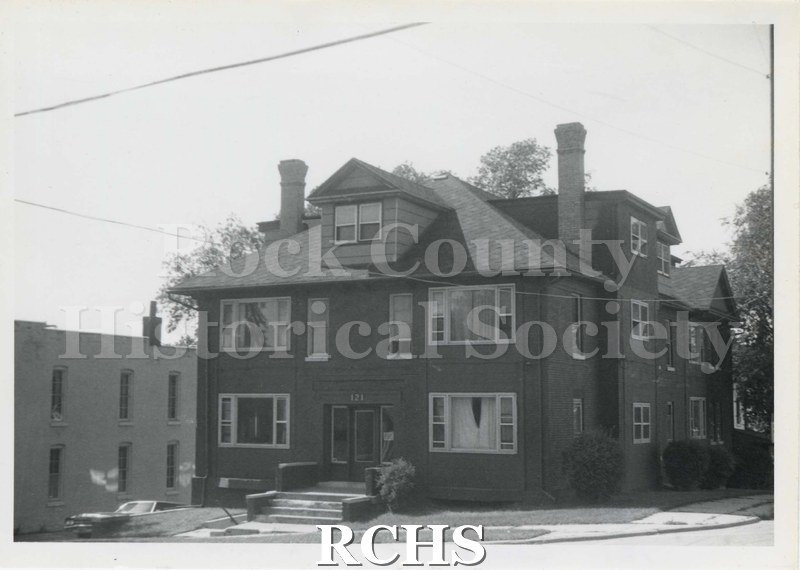 Black and white photograph of 121 Court Street, a three story brick apartment building.