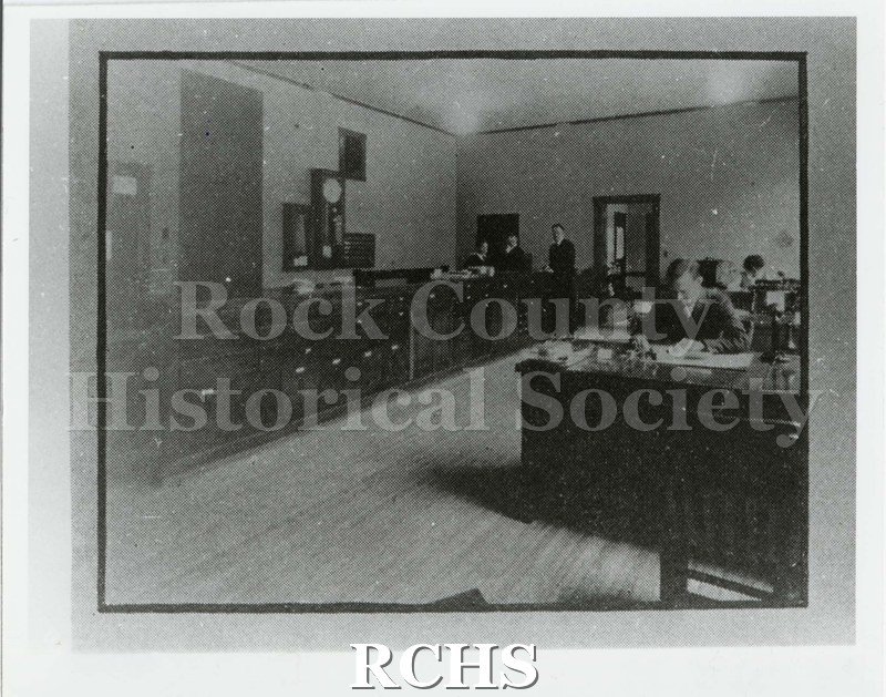 Black and white photograph of the Janesville High School main office/principal's office.